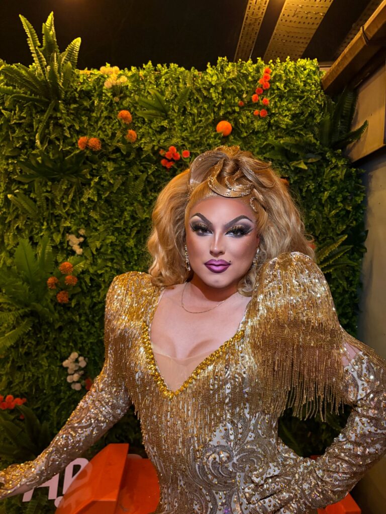 Alyssa looking glam in a matching gold wig and dress